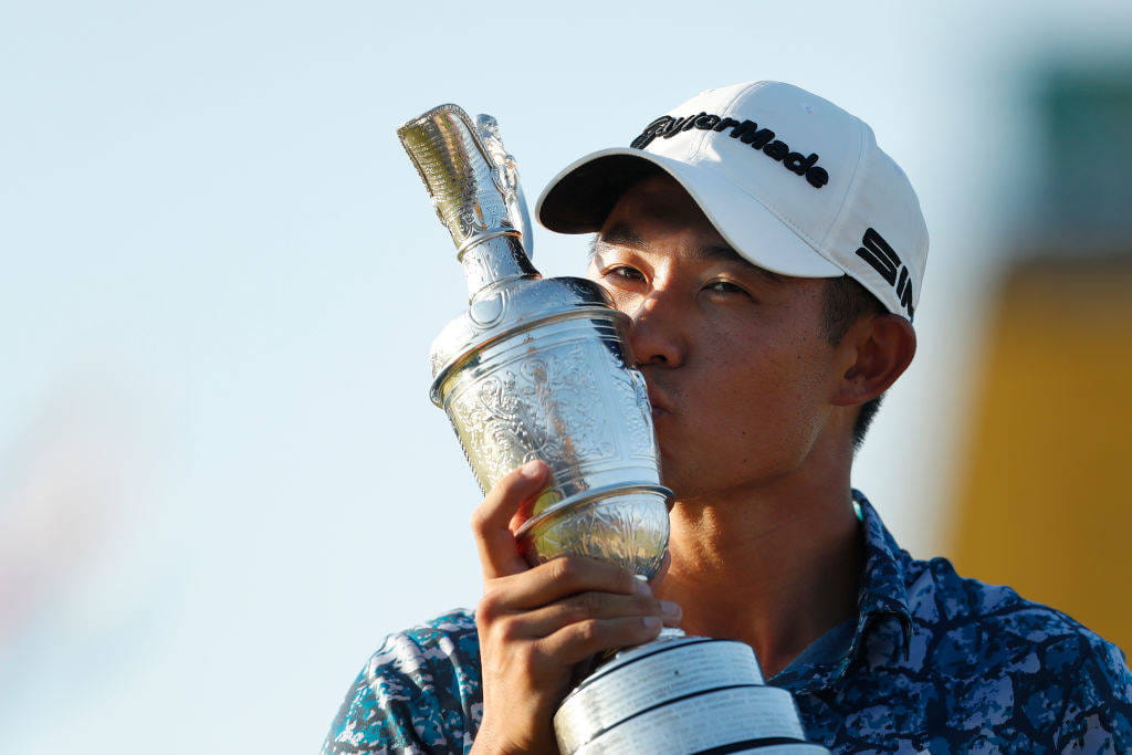 Collin Morikawa kisses the Claret Jug after winning The 149th Open